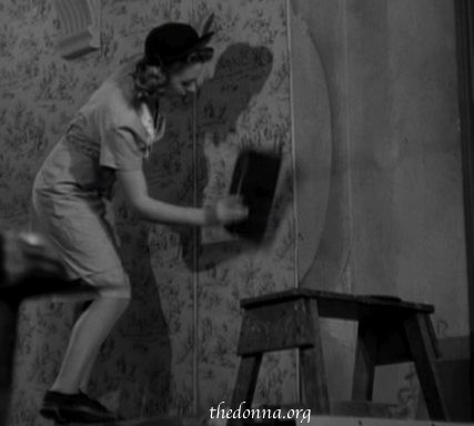 Mary working on the stairway wallpaper.